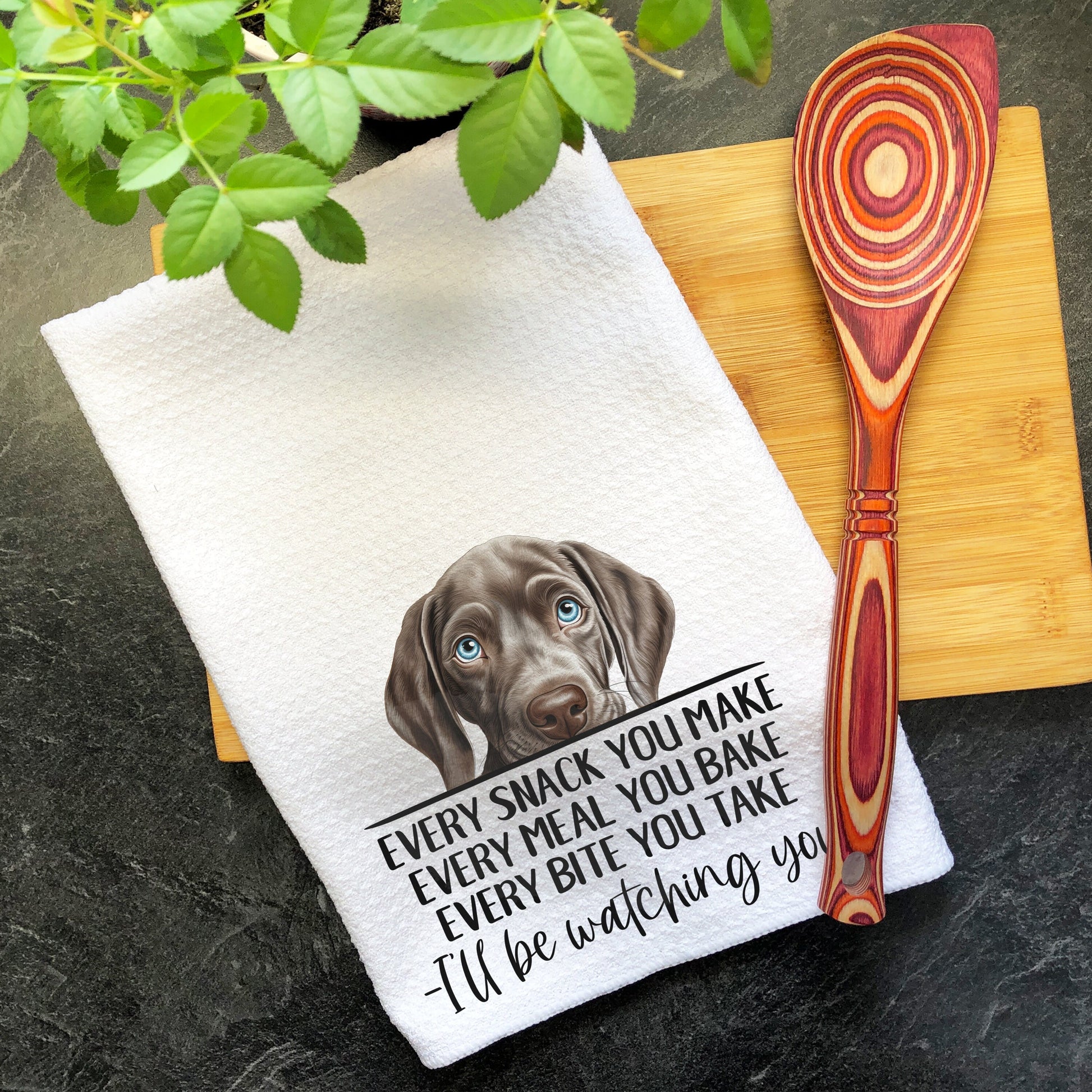 a kitchen towel with a brown dog on it