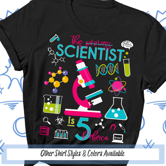 a black t - shirt with a science themed design