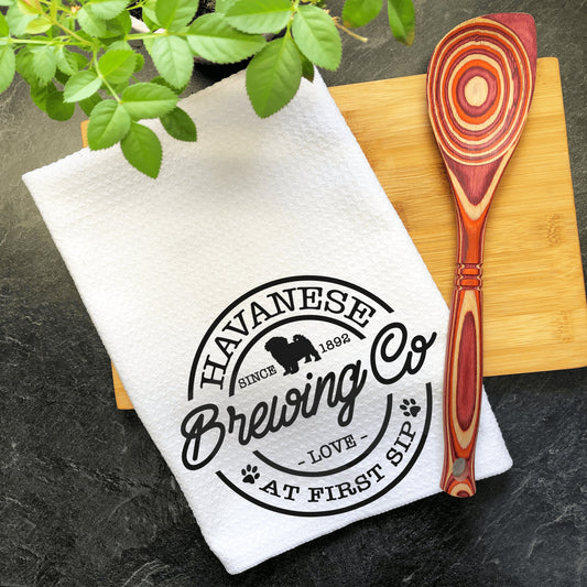 a wooden spoon sitting on top of a cutting board