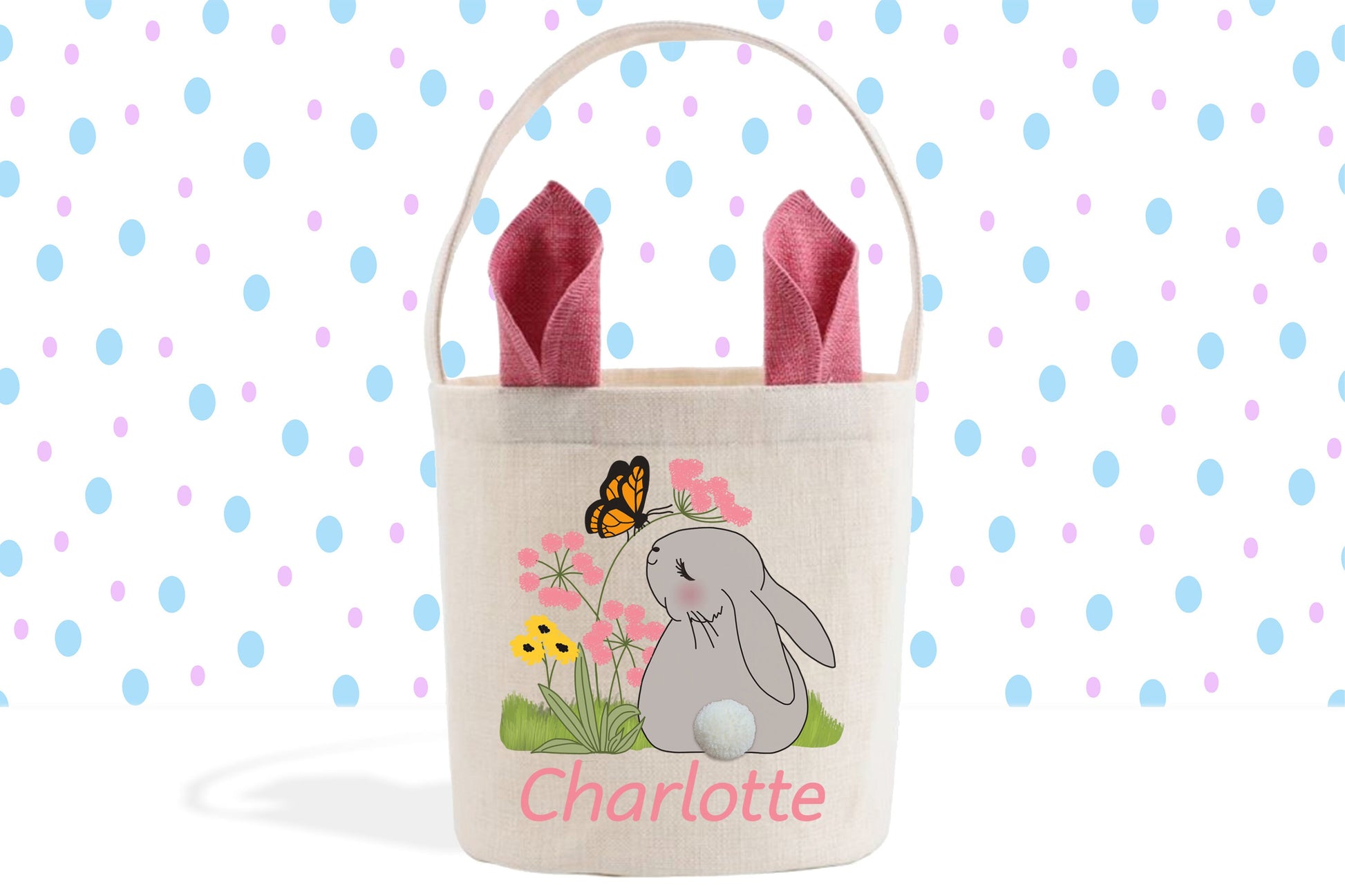 a white bag with a rabbit and a butterfly on it