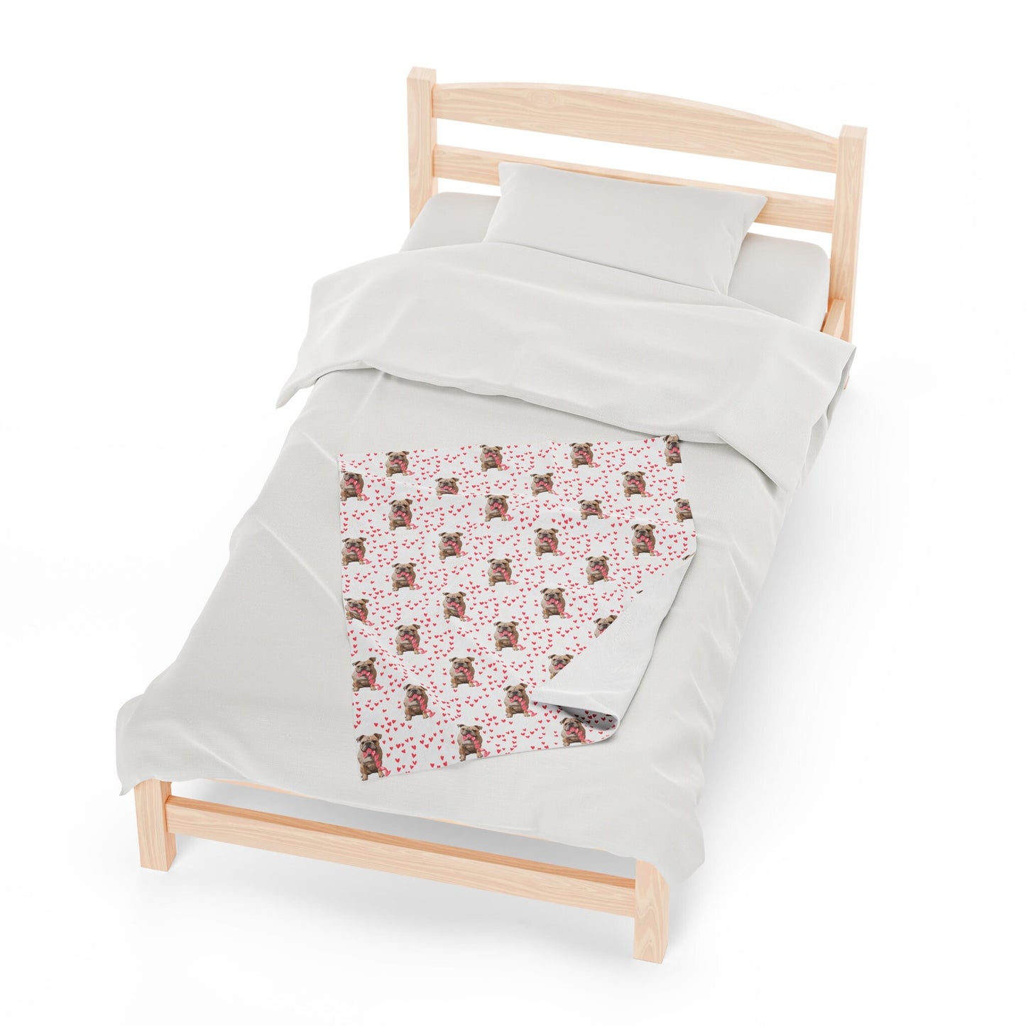 a bed with a white comforter and a pink and brown quilt