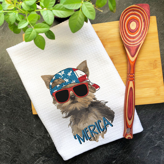 a tea towel with a dog wearing sunglasses and a hat