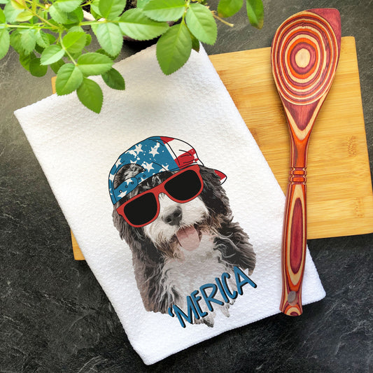 a tea towel with a dog wearing a hat and sunglasses
